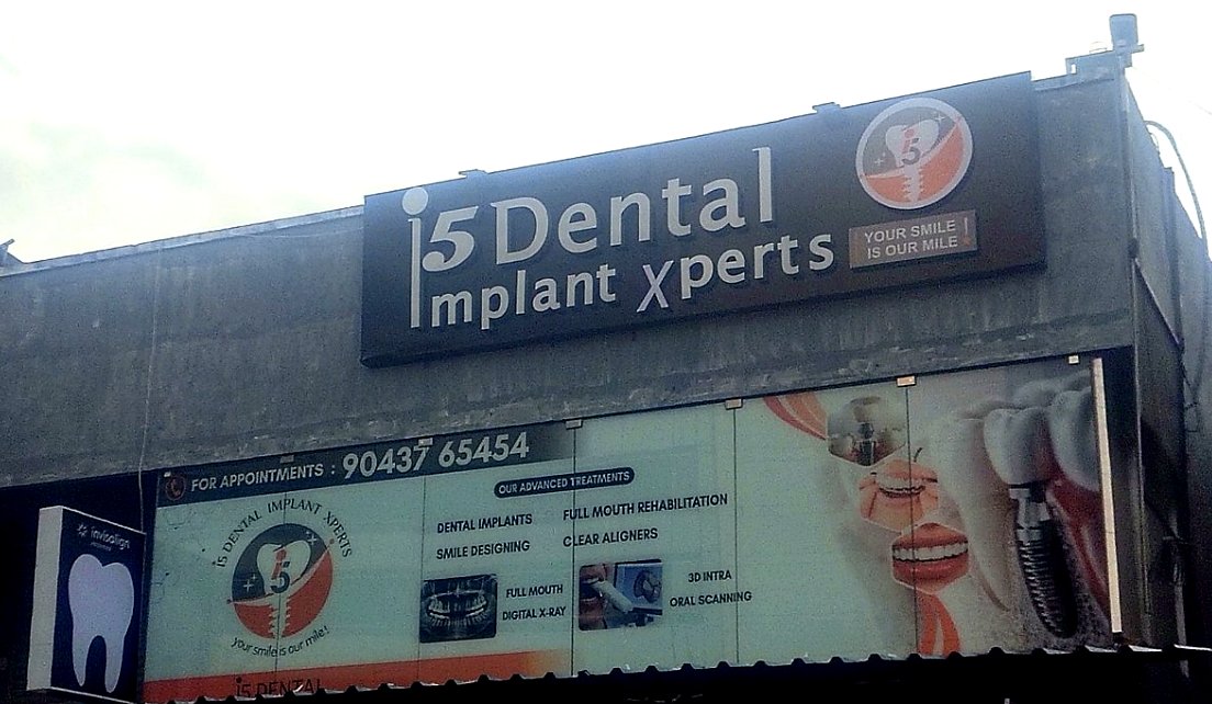 i5 Dental Implant Xperts signboard and clinic front on MGR Salai